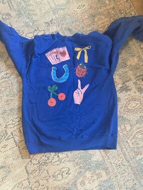 Blue Graphic Sweatshirt with Playful Icons